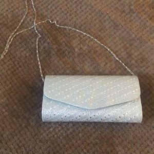 Silver, rhinestone evening clutch with a thin chain
